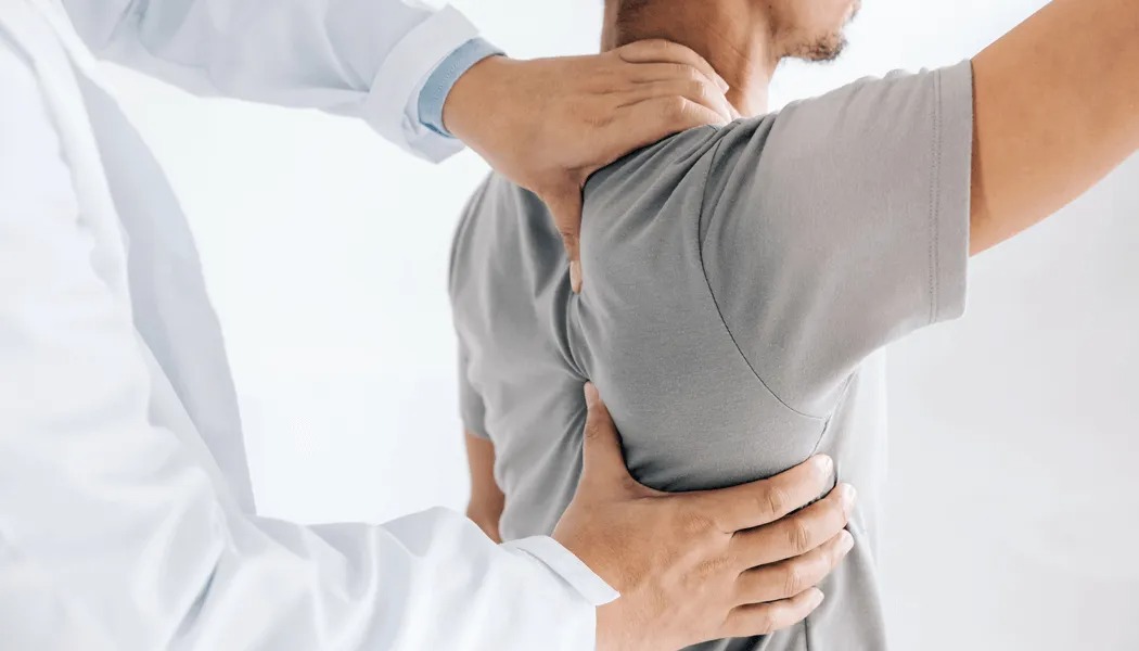 How long does it take for ergonomic changes to reduce shoulder pain